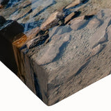 Close-up of a stretched canvas wall art piece depicting a serene mountain landscape at sunset, showcasing vibrant colors and detailed textures, perfect for home decor.