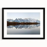 Framed wall art featuring a stunning mountain landscape design, presented in a sleek black frame with a white mat, perfect for home decor enthusiasts.