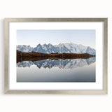 Framed wall art featuring a stunning mountain landscape design, complete with a silver mat and sleek frame, perfect for home decor and nature enthusiasts.