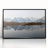 Framed wall art showcasing a serene mountain landscape design with vibrant colors and intricate details, set against a sleek black frame for modern decor.