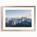 Framed wall art showcasing a serene mountain landscape design with a silver mat, perfect for home decor or office settings, enhancing any interior ambiance.