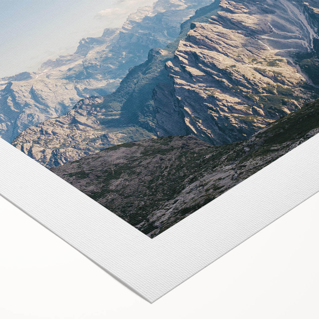 Vibrant rolled canvas showcasing a stunning mountain landscape design, emphasizing rich colors and intricate details, perfect for home decor or art enthusiasts.