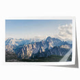 Mountain landscape wall art print featuring vibrant blue skies and majestic peaks, rolled and ready for display in home decor. Ideal for nature enthusiasts.