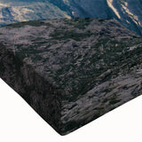 Close-up of a stretched canvas wall art piece depicting a serene mountain landscape in vibrant colors, showcasing rich textures and intricate details, ideal for home decor.