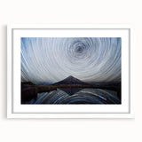 Framed wall art featuring a serene mountain landscape design, accented with a white mat, ideal for enhancing home decor with nature-inspired aesthetics.