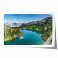 Stunning wall art print showcasing a vibrant landscape of majestic mountains under a bright blue sky, rolled and ready for display in home decor.
