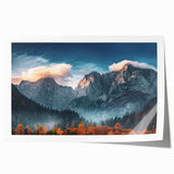 Vibrant landscape wall art print showcasing majestic mountains under a bright blue sky, rolled and ready for framing, perfect for enhancing home decor.