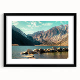 Framed wall art showcasing a stunning mountain landscape design with a black mat, perfect for adding a touch of nature to modern home decor.