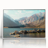 Framed acrylic wall art showcasing a serene mountain landscape design in soft pastel colors, ideal for modern home decor. The artwork is presented in an elegant white frame, enhancing any interior space with its tranquil aesthetic.