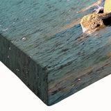 Close-up of a stretched canvas featuring a vibrant mountain landscape design, showcasing rich colors and intricate details, perfect for home decor in a modern setting.