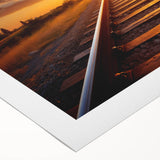 Rolled canvas artwork depicting a serene landscape with a railroad winding through lush greenery, showcasing vibrant colors and intricate details, ideal for home decor.