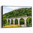 Framed canvas wall art collection showcasing a scenic landscape with railroads, presented in a sleek black frame, ideal for enhancing home decor.