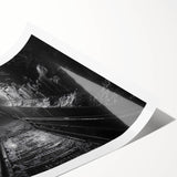 Rolled print showcasing a vibrant landscape featuring a railroad track meandering through lush green hills, ideal for home decor or art collection.