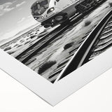 Rolled canvas depicting a vibrant railroad landscape scene with lush greenery and blue skies, perfect for enhancing home decor. Packaged securely in a durable tube for easy transport.