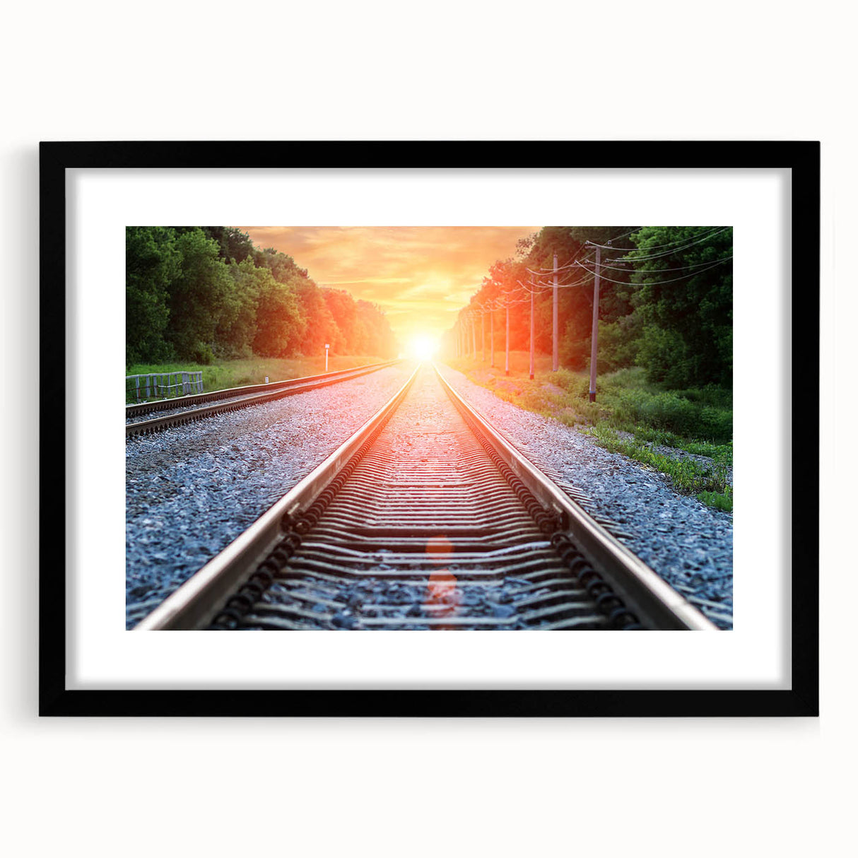 Framed wall art showcasing a stunning landscape scene with railroads, featuring a sleek black frame and white matting, perfect for modern home decor.