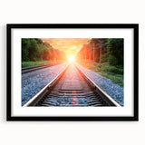 Framed wall art showcasing a stunning landscape scene with railroads, featuring a sleek black frame and white matting, perfect for modern home decor.