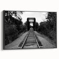 Framed black canvas wall art featuring a landscape railroad design, showcasing intricate details and vibrant colors, perfect for modern home decor.