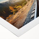 Rolled canvas artwork depicting a serene landscape with railroads, featuring vibrant colors and intricate details, ideal for enhancing home decor.