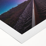 Rolled canvas showcasing a vibrant landscape of railroad tracks winding through lush green hills, perfect for home decor and art enthusiasts, emphasizing nature and travel themes.