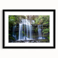 Framed rainforest landscape wall art with a black mat and sleek frame, showcasing vibrant greenery and serene nature, perfect for home decor or office spaces.