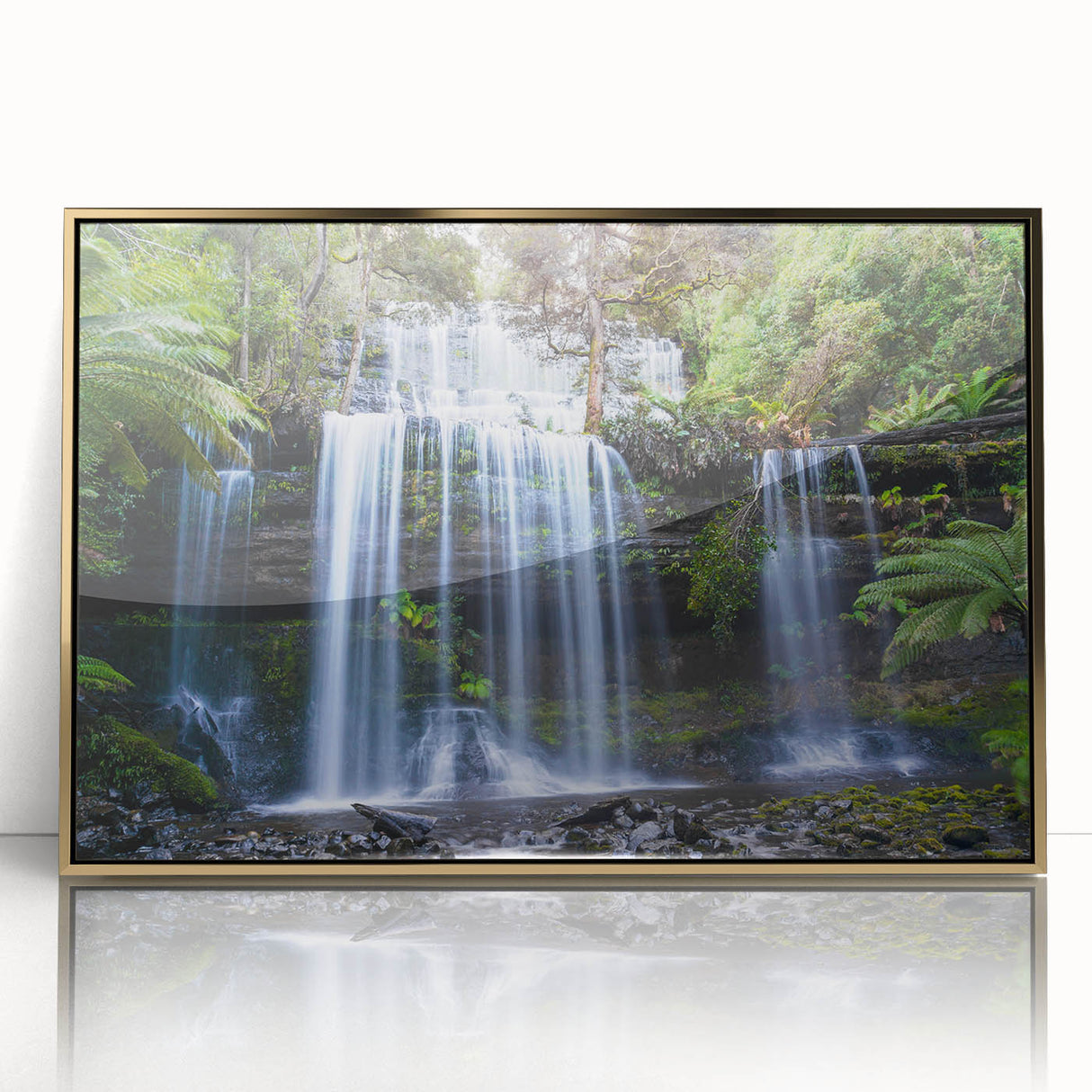 Framed acrylic wall art showcasing a vibrant rainforest landscape design with gold accents, perfect for adding a touch of nature-inspired elegance to any room.