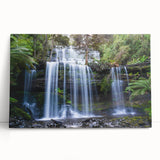 Vibrant stretched canvas wall art depicting a lush rainforest landscape with vivid greens and blues, perfect for adding nature-inspired decor to any space.