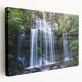 Stretched canvas wall art featuring a vibrant rainforest landscape design with lush greenery and colorful flora, ideal for nature-themed decor in living spaces.