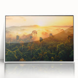 Framed wall art depicting a vibrant rainforest landscape, featuring lush green foliage and a serene atmosphere, designed to enhance modern home decor.
