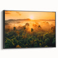 Framed canvas wall art of a vibrant rainforest landscape featuring lush greenery and rich colors, displayed in a sleek black frame, perfect for home decor.
