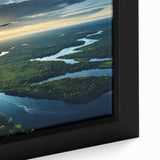 Close-up of a framed canvas print showcasing a vibrant rainforest landscape design, featuring lush greenery and intricate details, perfect for nature-inspired decor.