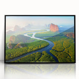 Framed acrylic wall art showcasing a vibrant rainforest landscape design, featuring lush green foliage and rich colors, presented in a sleek black frame, perfect for nature enthusiasts and modern decor.