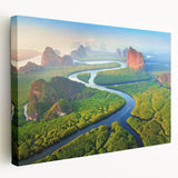 Stretched canvas wall art showcasing a vibrant rainforest landscape design with lush greenery and tropical plants, ideal for nature-themed decor.