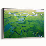 Framed wall art showcasing a vibrant rainforest landscape with lush greenery and colorful foliage, presented in a sleek silver frame, perfect for enhancing any living space.
