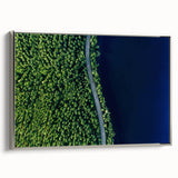 Framed canvas wall art showcasing a serene landscape design featuring winding roads and lush greenery, complemented by a sleek silver frame, perfect for home decor.