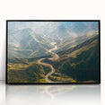 Framed acrylic wall art featuring a scenic landscape with winding roads, presented in a sleek black frame, ideal for modern home decor. The vibrant colors and intricate details evoke a sense of adventure and tranquility, enhancing any living space.