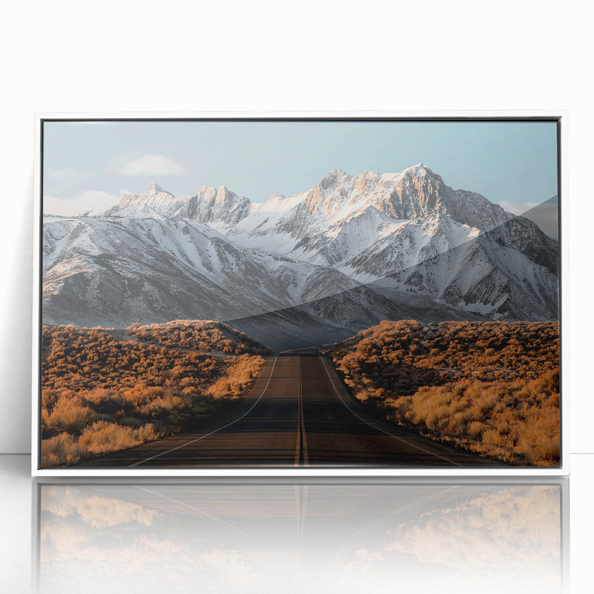Framed acrylic wall art featuring a serene landscape with winding roads, displayed in a sleek white frame, ideal for modern home decor and interior design.