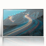 Framed wall art featuring a scenic landscape design with winding roads, displayed in a sleek white frame, perfect for modern home decor.