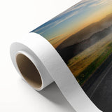 Rolled canvas artwork showcasing a vibrant landscape road design, featuring rich colors and intricate details, perfect for enhancing modern home decor.
