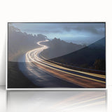 Framed acrylic wall art featuring a serene landscape with winding roads and vibrant greenery, presented in a sleek white frame for an elegant home decor accent.