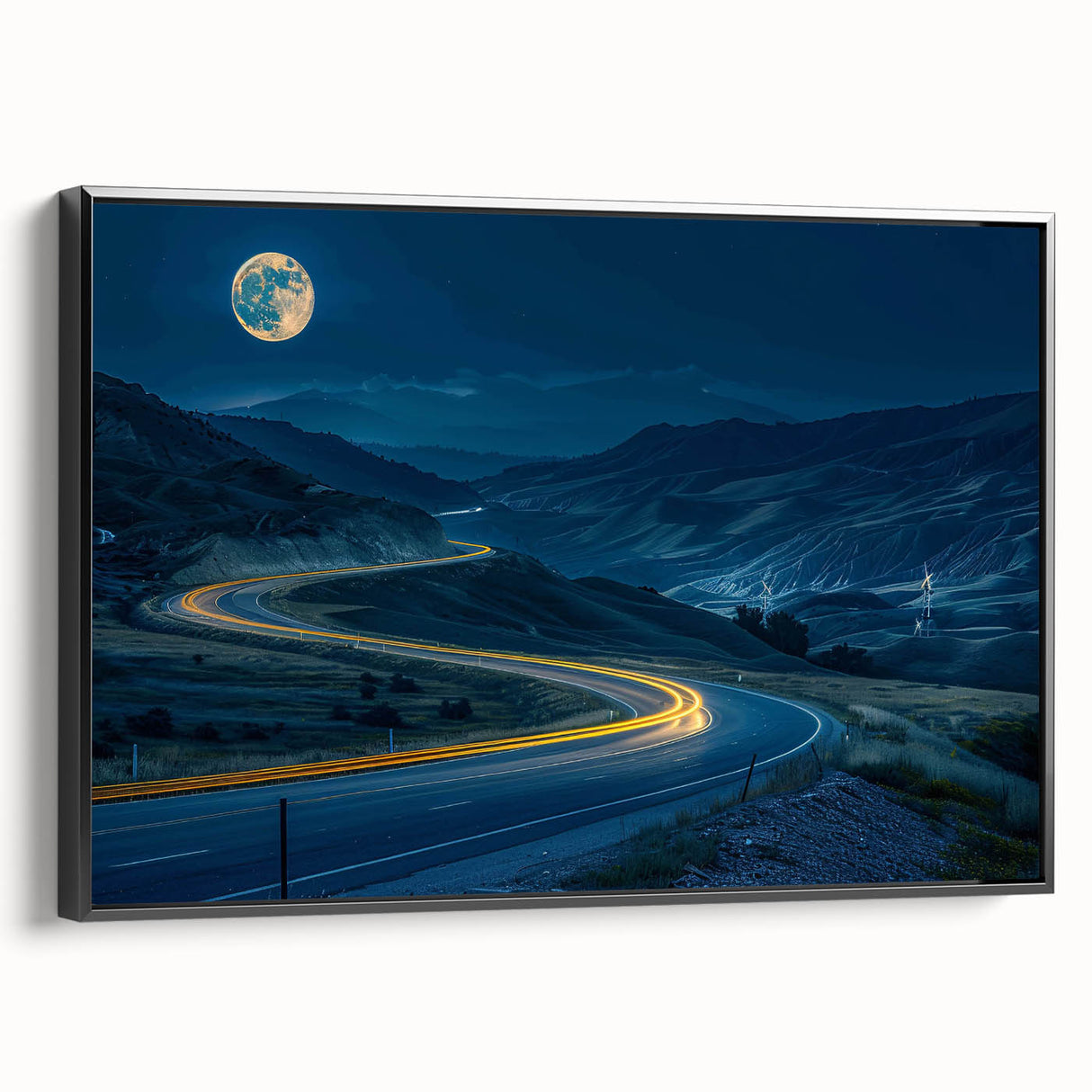 Framed canvas wall art showcasing a scenic landscape with winding roads, presented in a sleek black frame, enhancing modern home decor aesthetics.