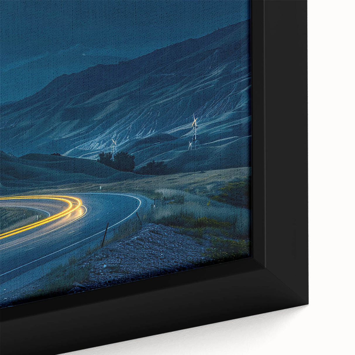 Close-up of a framed canvas wall art design showcasing a serene landscape with winding roads, rich colors, and intricate details, perfect for home decor.
