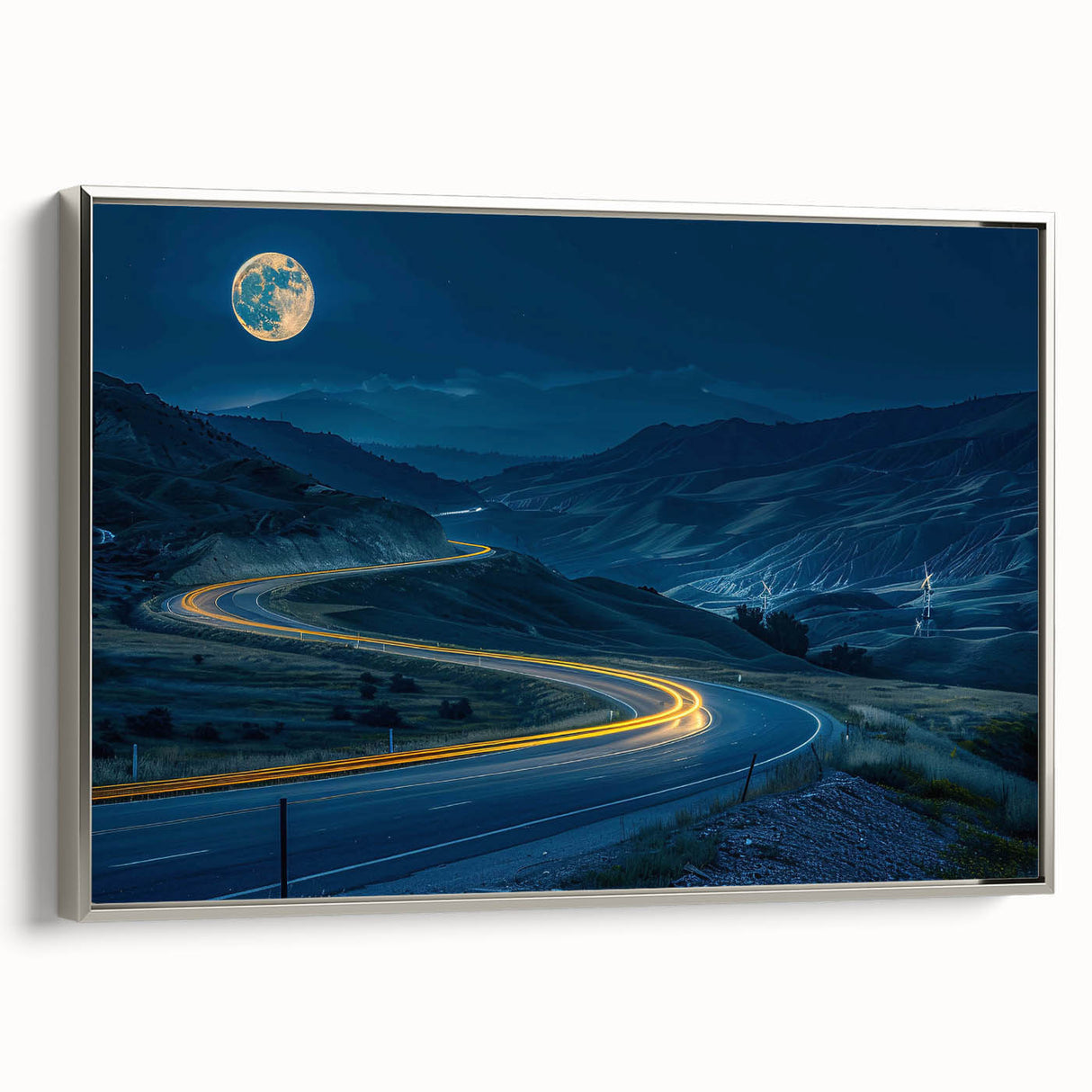 Framed canvas wall art showcasing a serene landscape with winding roads, set in a sleek silver frame, perfect for modern home decor. Ideal for adding tranquility to any space.