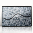 Framed acrylic wall art showcasing a scenic landscape with winding roads, featuring a sleek black frame, perfect for modern home decor. Ideal for enhancing interior aesthetics.