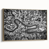 Framed canvas wall art featuring a scenic landscape with winding roads and lush greenery, accented with a gold frame, ideal for modern home decor.