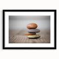Framed wall art featuring a stunning landscape design with rocks, set in a sleek black frame with a white mat, ideal for modern home decor.