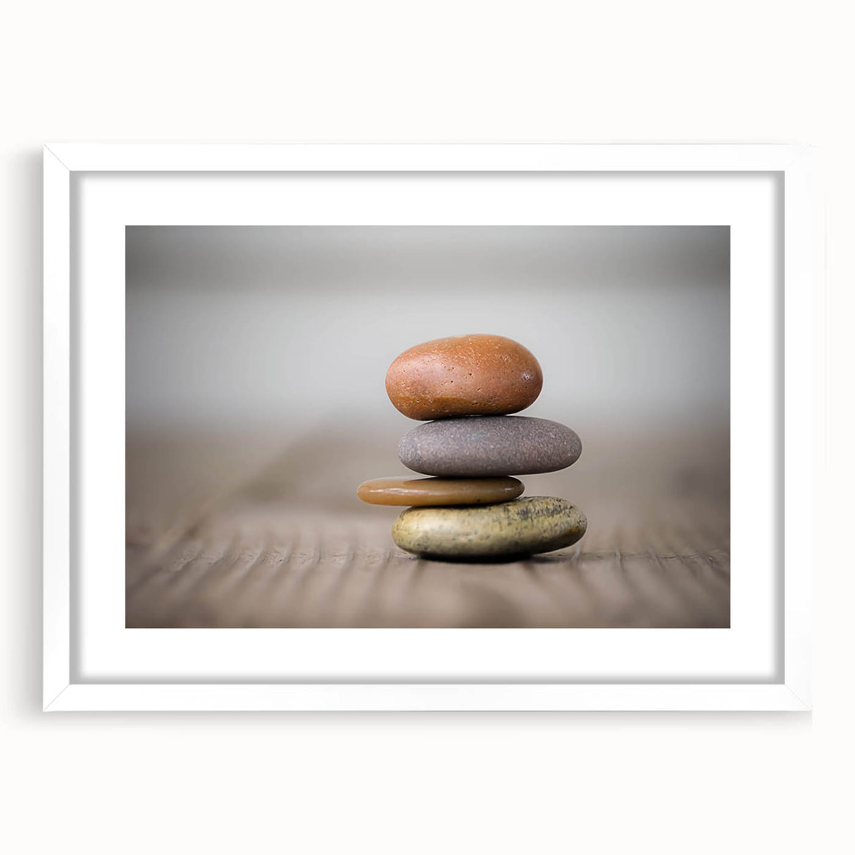 Framed wall art print showcasing a serene landscape with textured rocks, displayed in a white mat and frame, perfect for enhancing home decor.