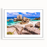 Framed wall art featuring a serene landscape with rocky formations, presented in a sleek white frame with a mat, ideal for enhancing modern decor.