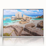 Framed acrylic wall art showcasing a serene landscape with rocks, complemented by a white frame, perfect for modern home decor. Ideal for nature enthusiasts and art lovers.