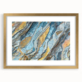 Gold-framed wall art featuring a serene landscape with rocks, designed for elegant home decor. The artwork is beautifully matted, enhancing its visual appeal.