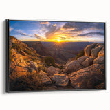Framed canvas wall art showcasing a modern landscape design with rocks, featuring a black frame and side view, perfect for contemporary home decor.